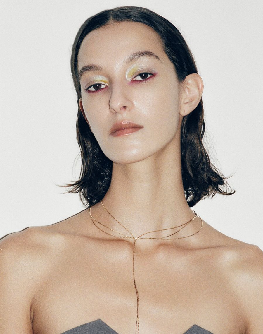 Beauty portrait with yellow and white eyeshadow and berry liner